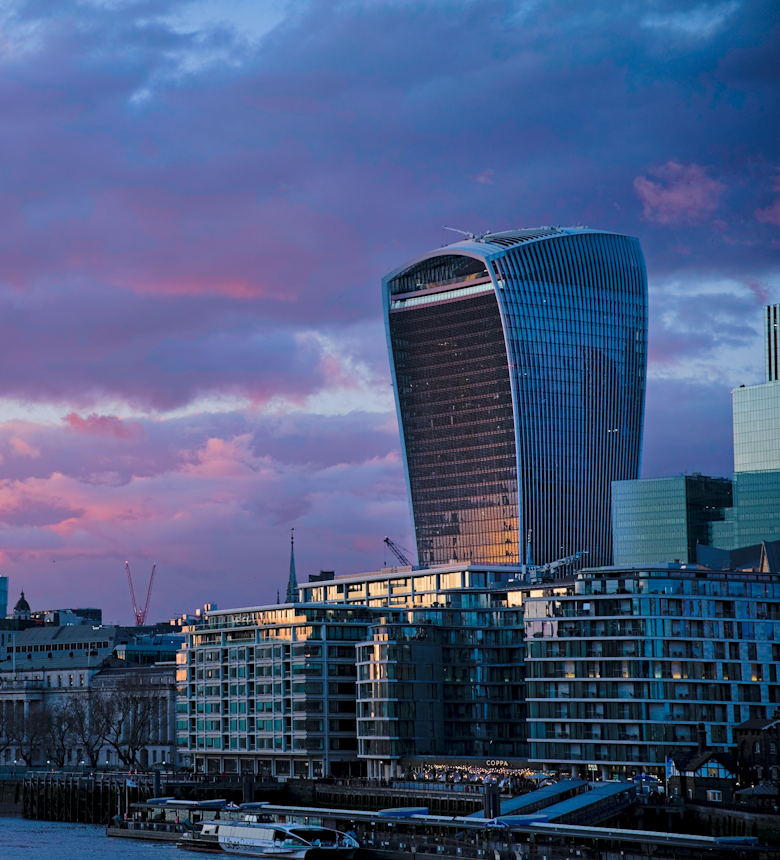 City of London skyline and the Thames at sunset. Photo by Mi C on Unsplash.